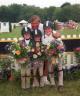 Liz Mahoney, Vivian Yowan, and Ula Green, USEF Emerson Burr Horsemanship Award Winners, with Bruce Burr. Photo courtesy of Reflections Photography